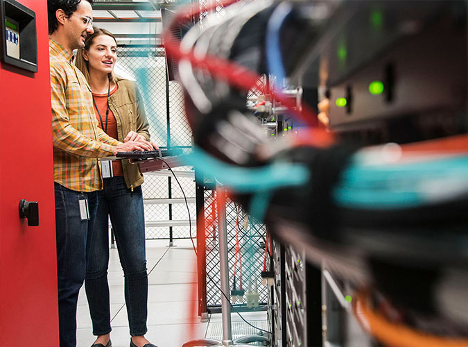 Employees in a server room