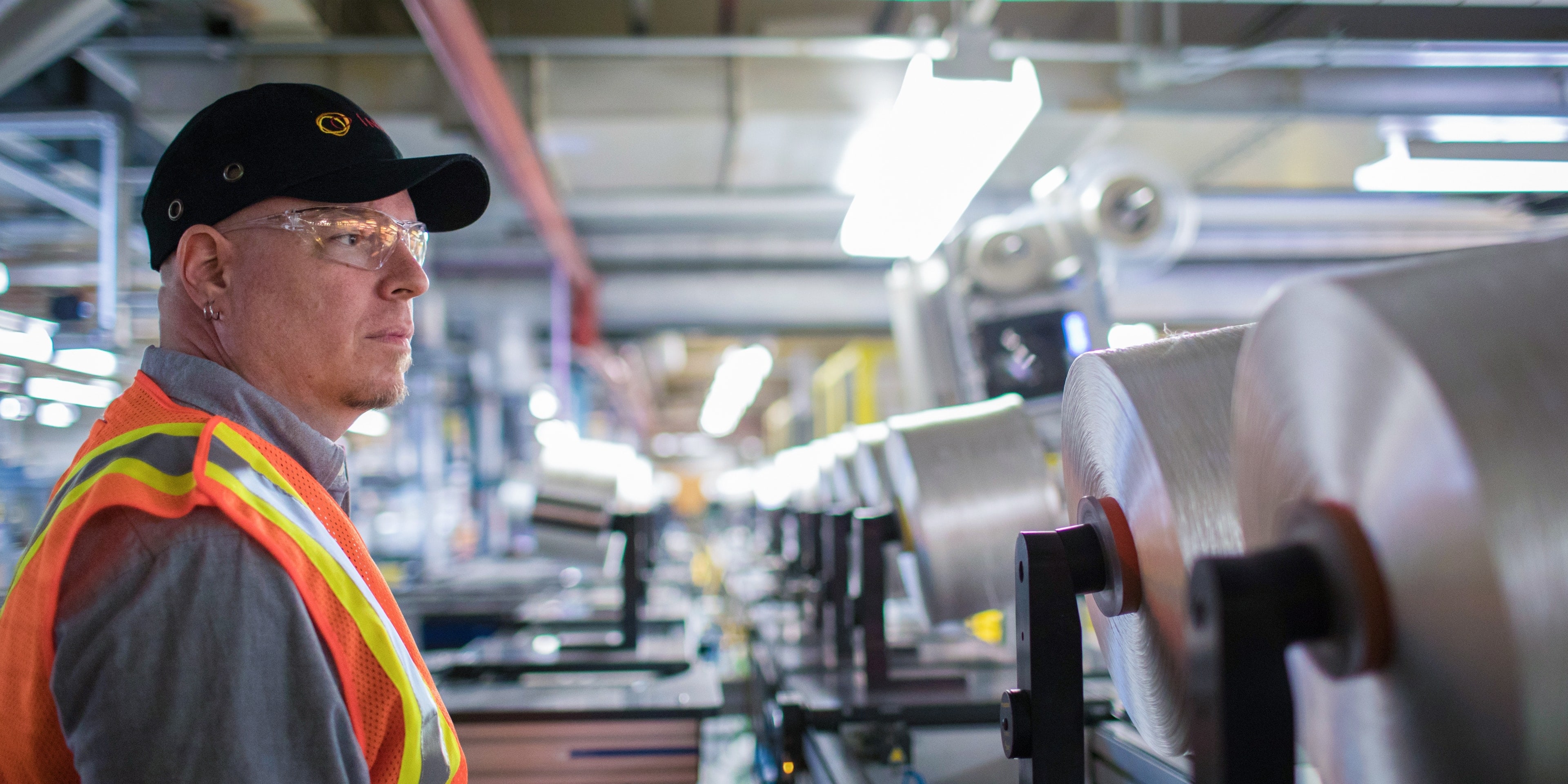 Operator with Spools of Thread