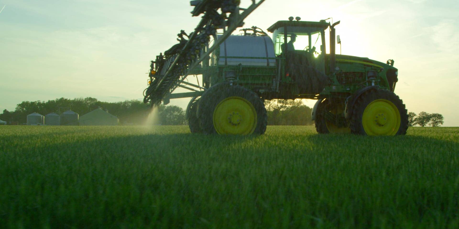 Tractor fertilizing crops