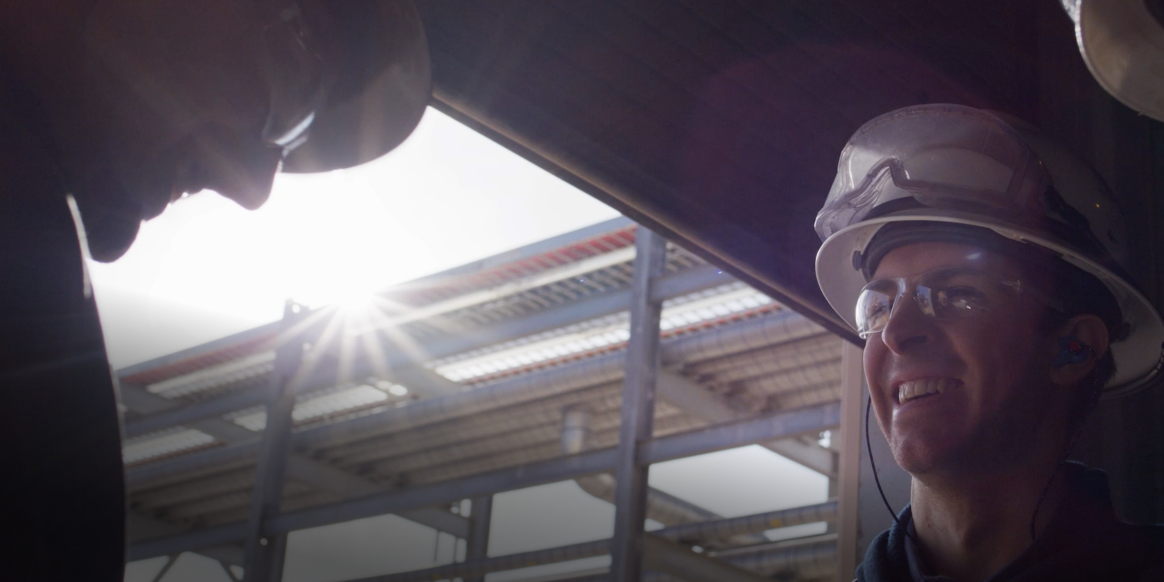 Koch Industries employee and a welding robot